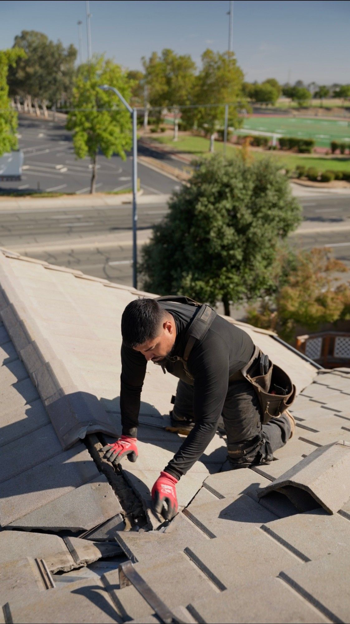 A Triple R Roofing crew member repairing a broken tile roof in Elk Grove, California.