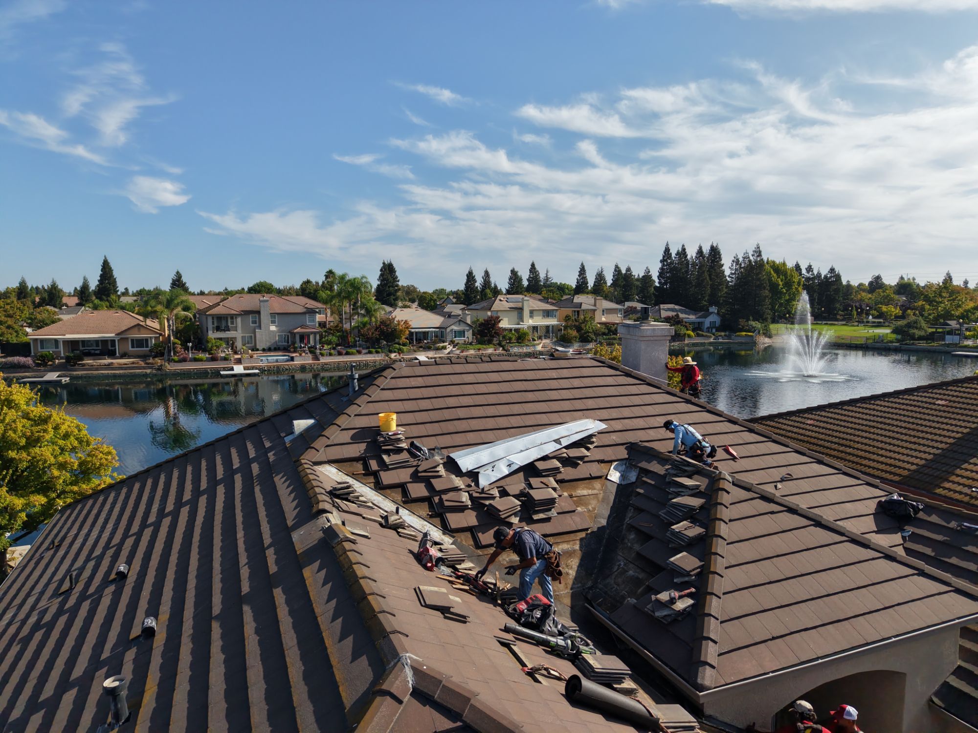 Aerial view of the Triple R crew performing roof maintenance.